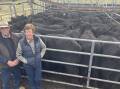 Kerry and Marlene Pearce, Muronga Pastoral Co, Adelong, were awarded the best presented pen of heifers for their 27 Angus heifers, 378kg, sold for $1260 at Gundagai on Friday. Picture by Alexandra Bernard. 