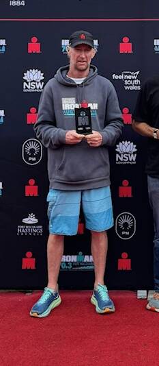 Adrian Trotter on the podium after the recent Australian Ironman Triathlon in Port Macquarie.