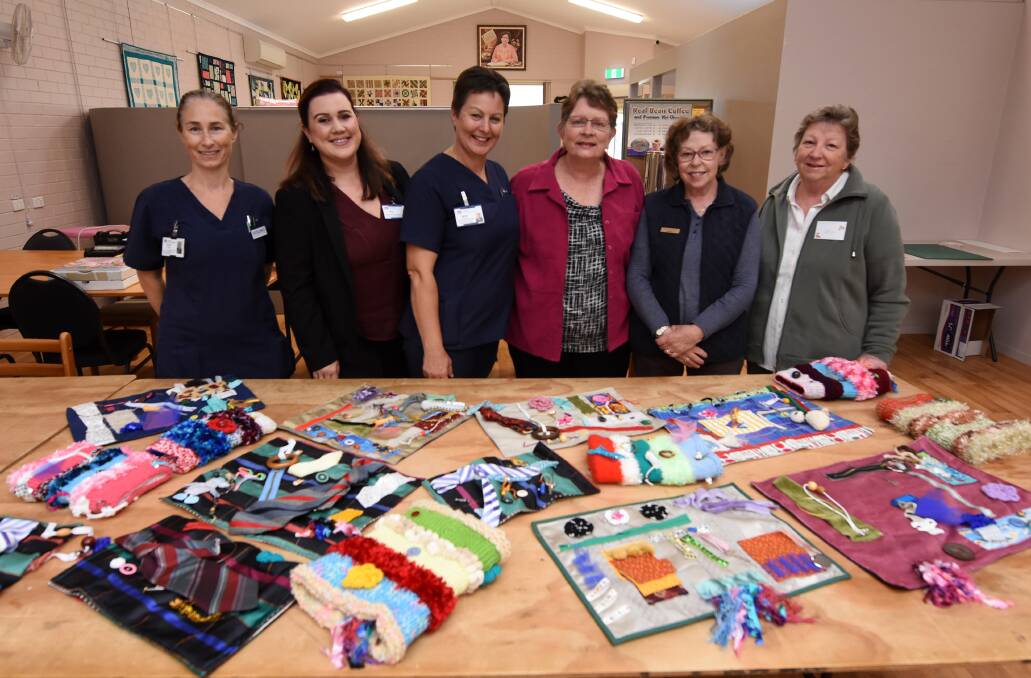 Craft for therapy: Manning Hospital's Naomi Case, Erin Hunt and Karen DeGida with Pam Eyb, Anne Fernley and Leith Colledge from Taree Craft Centre.