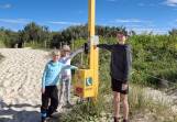 Visiting Nine Mile Beach, Tuncurry, Isobel (7), Eleanor (7) and Charlie (10) were quick to locate the white contact button. Picture Anne Evans.