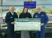 Tanya Thompson (centre) hands over the $12,000 to Geoff Anderson and Rod Percival. Picture supplied.