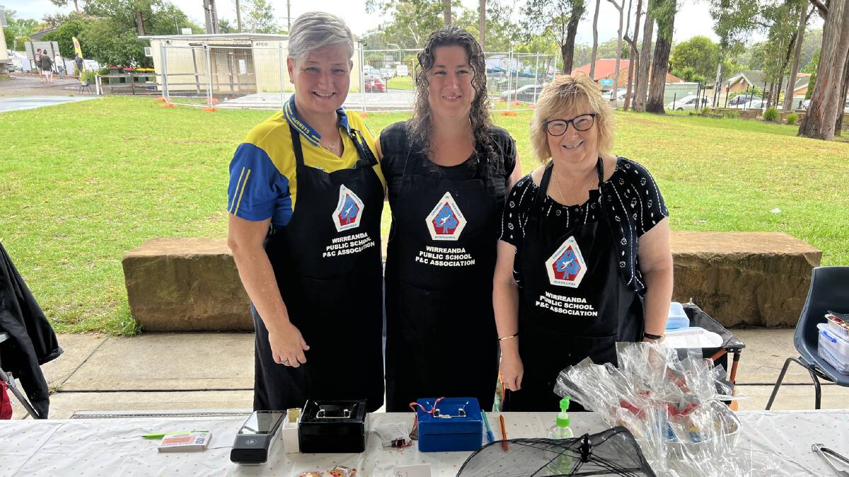 Wirreanda Public School P&C members Sally Rolfe, Elizabeth O'Rourke and Rhiannon McCartney manning the lolly and bake stall on the Medowie polling booth on Saturday morning.