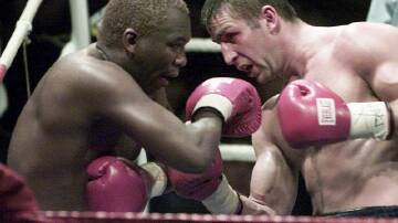 Two-weight boxing champion Dingaan Thobela (l) has died at the age of 57. (AP PHOTO)