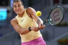 Aryna Sabalenka crushes a backhand during her hard-fought win over Danielle Collins in Madrid. (AP PHOTO)