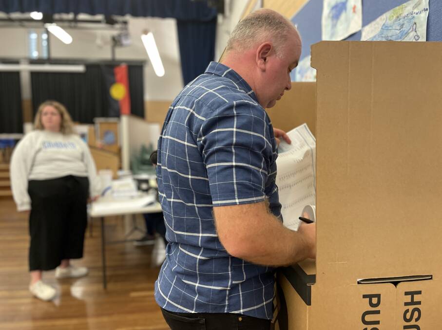 Port Stephens Liberal candidate Nathan Errington casts his vote at the Raymond Terrace Public School booth.